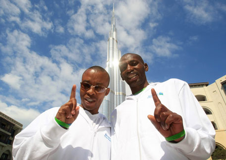 Visually impaired Henry Wanyoike (left) and his long-time running partner Joseph Kibunja. (PATRICK CASTILLO)