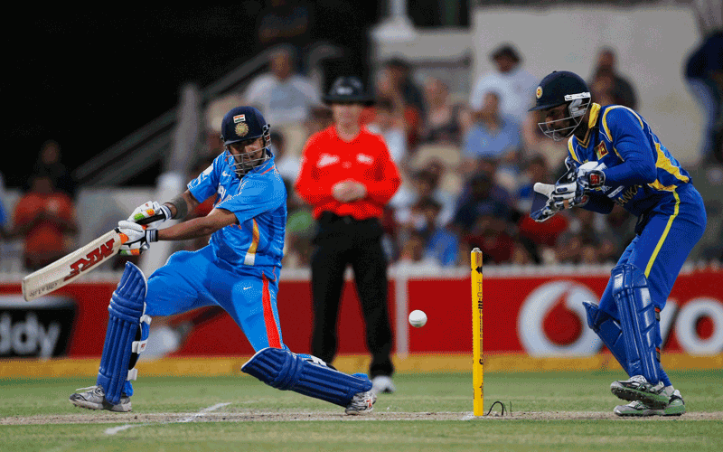 Gautam Gambhir (L) of India plays a shot as wicket keeper Kumar Sangakkara of Sri Lanka looks on during their one-day international cricket match in Adelaide. (REUTERS)