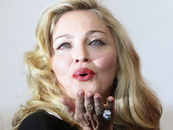 Pop diva Madonna blow kisses to her fans. (REUTERS)