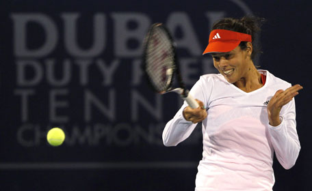 Ana Ivanovic of Serbia hits a return to Francesca Schiavone of Italy during their women's singles match at the WTA Dubai Tennis Championships on Tuesday. (REUTERS)