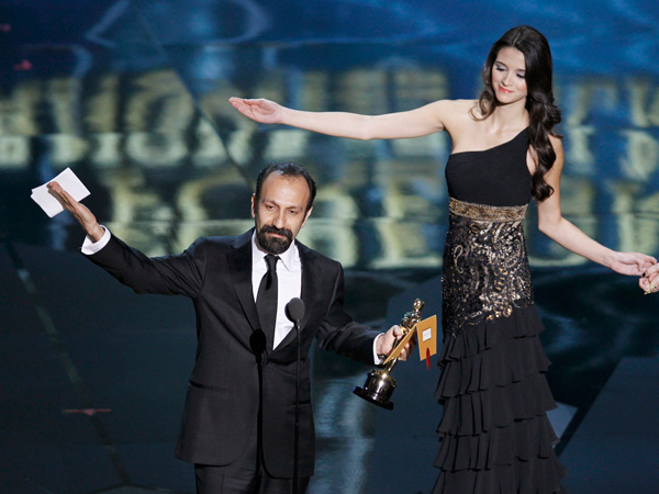 Asghar Farhadi, director of Iranian film "A Separation"  is guided off stage after accepting the Oscar for Best Foreign Language Film at the 84th Academy Awards in Hollywood, California, February 26, 2012.  (REUTERS)