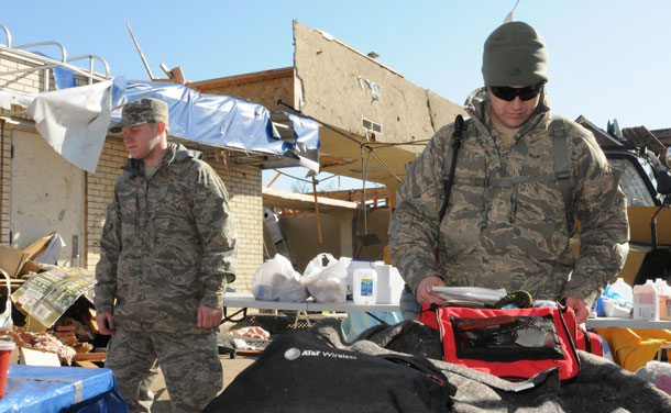 Senior Airman Anthony Gardner (L) and Airman 1st Class TJ Bothur, both from the 123rd Medical Group, prepare their packs for possible search and extraction missions in West Liberty, Kentucky, in this US Air Force. (REUTERS)
