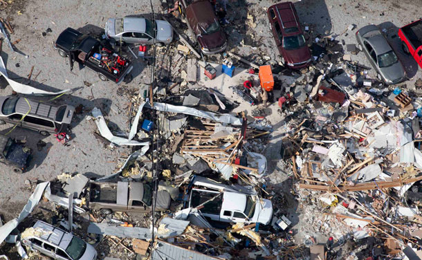 An aerial view shows wrecked cars amid debris in the wake of a tornado in Marysville, Indiana. (REUTERS)