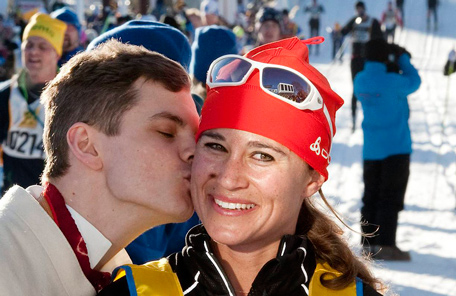 Pippa Middleton (C), sister of Kate Middleton, the Duchess of Cambridge, receives a welcoming kiss from local race steward Erik Smedhs after crossing the finish line of the 88th Vasaloppet cross country ski marathon in Mora. Pippa finished the 90km (56 miles) race from Salen to Mora in just over 7 hours. (REUTERS)