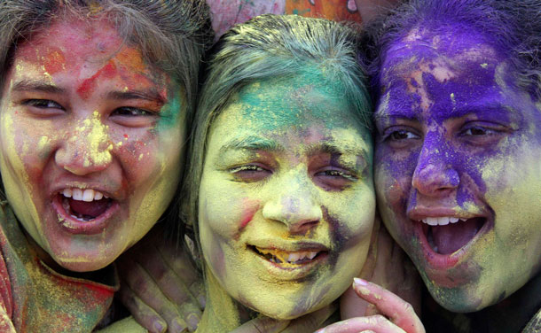 Students, with their faces smeared in coloured powder, celebrate Holi, also known as the festival of colours, at a college in the northern Indian city of Chandigarh March 2, 2012. The traditional event heralds the beginning of spring and will be celebrated all over India on March 8. (REUTERS)