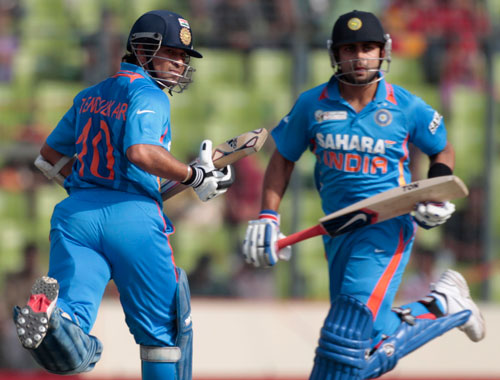 India's Sachin Tendulkar (left) and Virat Kohli run between the wickets against Bangladesh during their One Day International (ODI) cricket match of Asia Cup in Dhaka March 16, 2012 (REUTERS)