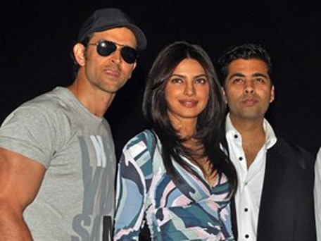 Indian Bollywood actors Hrithik Roshan (L) and Priyanka Chopra pose with director and producer Karan Johar (R) during a press conference to promote their Hindi film 'Agneepath' directed by debutant Karan Malhotra in Mumbai on December 23, 2011. (AFP/GETTY images)
