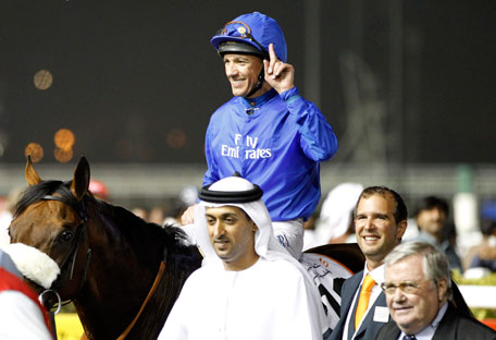 Lanfranco Dettori, riding Opinion Poll, celebrates after winning the third race of the 17th Dubai World Cup at the Meydan racecourse in Dubai on Saturday. (REUTERS)