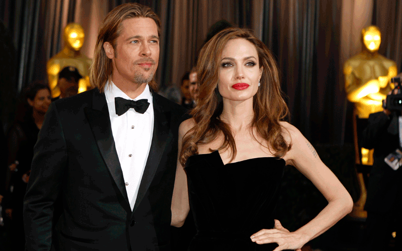 Actor Brad Pitt poses with his partner actress Angelina Jolie on the red carpet at the 84th Academy Awards in Hollywood, California, in this February 26, 2012 file photo. Jolie and Pitt are engaged to marry, a spokeswoman for Pitt said on April 13, 2012. "Yes, it's confirmed. It is a promise for the future and their kids are very happy. There's no date set at this time," Pitt's spokeswoman Cynthia Pett-Dante told Reuters. Jolie was photographed this week wearing a large diamond ring on her engagement finger. Pitt and Jolie have been a couple since 2005, and are raising six children together, but they have never married. (REUTERS)
