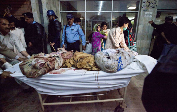 Relatives of passengers of the Bhoja Air passenger plane which crashed look on as hospital workers transport bodies of victims recovered from the plane wreckage in Islamabad April 20, 2012. The Pakistani airliner with 127 people on board crashed in bad weather as it came in to land in Islamabad on Friday, scattering wreckage and leaving no sign of survivors. The Boeing 737, operated by local airline Bhoja Air, was flying to the capital from Pakistan's biggest city and business hub Karachi. (REUTERS)