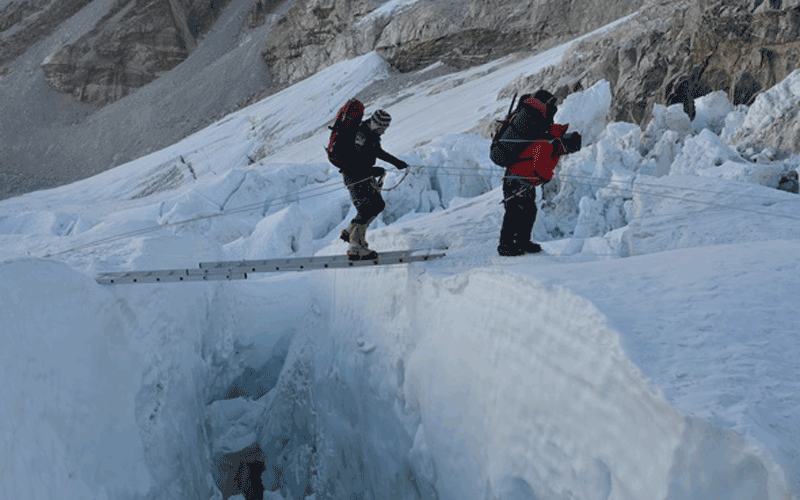 Crossing a crevasse in the Khumbu Icefall (Supplied)