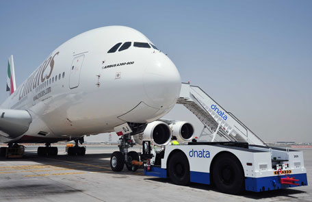 Dnata ground handling at work with an Emirates A380 (SUPPLIED)