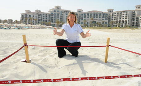 TDIC’s Environment Manager, Millie Plowman gets excited about the first Hawksbill turtle nest of the season being spotted at The St Regis Saadiyat Island Resort. (SUPPLIED)