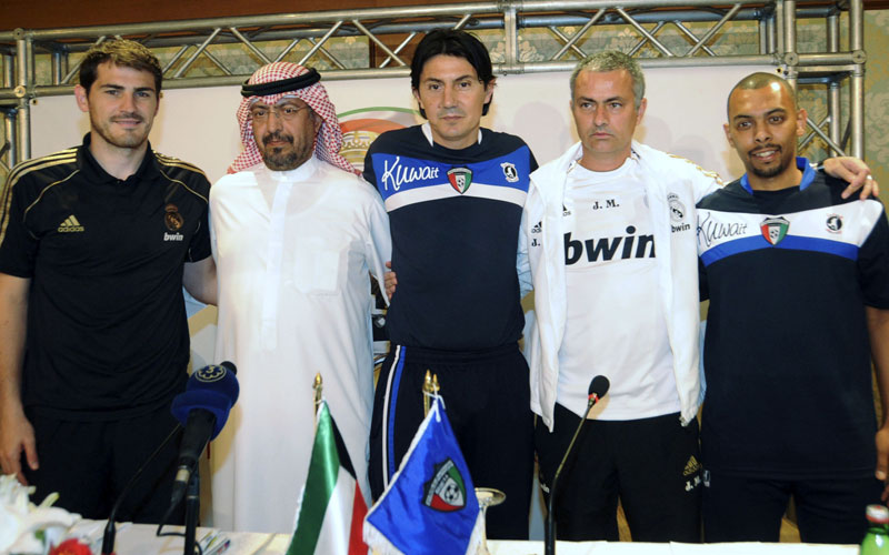 Real Madrid goalkeeper Iker Casillas (L) ,Talal Al Mohteb, media officer of Kuwait Football Association (2nd L), Kuwait coach Goran Tufegdzic (3rd L), Real Madrid coach Jose Mourinho (2nd R) and Kuwaiti national team player Jarrah Al Atigy pose for pictures during a news conference in Kuwait City May 15, 2012. Real Madrid was in Kuwait to play against the national team in a friendly soccer match on Wednesday. (REUTERS)