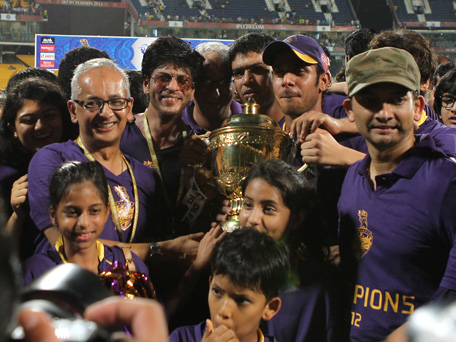 Bollywood star and co-owner of Kolkata Knight Riders Shah Rukh Khan (3rdL) poses with the DLF IPL 2012 cup as he celebrates his team's victory at the end of the IPL Twenty20 cricket final match in Chennai on May 27, 2012. (AFP)