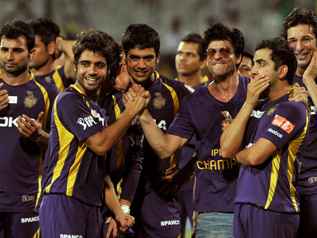 Kolkata Knight Riders owner and Bollywood actor Shah Rukh Khan (3rd R) celebrates with his teammates after they won the DLF IPL Twenty20 Champions Trophy. (AFP)