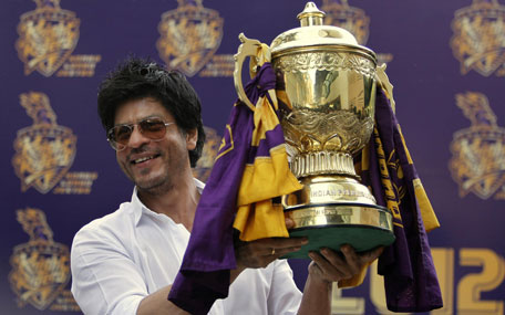 Kolkata Knight Riders team co-owner and Bollywood star Shah Rukh Khan poses with the Indian Premier League (IPL) trophy during a press conference at his residence in Mumbai, India. (AP)
