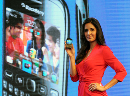Bollywood actress Katrina Kaif poses with a BlackBerry Curve 9220 smartphone during a product launch in New Delhi on April 18, 2012. (AFP/Getty Images)