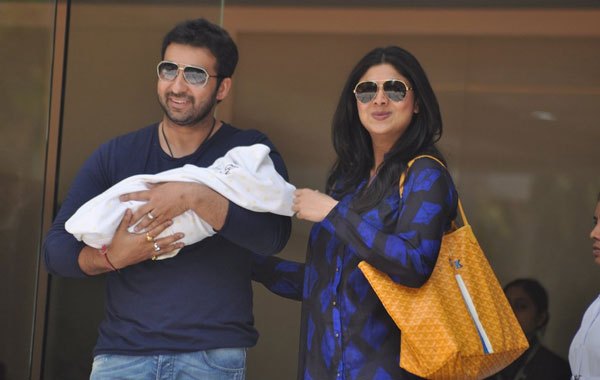 Bollywood actress Shilpa Shetty smile as she poses with her husband Raj Kundra holding their newborn baby boy outside a hospital in Mumbai. (AP)