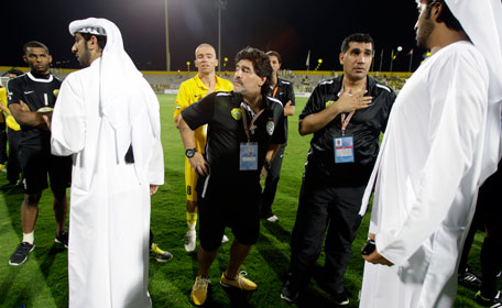 Al Wasl's Argentinian coach Diego Maradona (centre) reacts after they lost to Al Muharraq club from Bahrain during the final of the GCC Champions League in Dubai on Sunday. (AP)