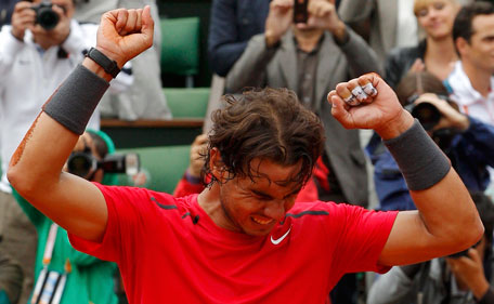 Rafael Nadal of Spain reacts after winning the men's singles final match against Novak Djokovic of Serbia at the French Open tennis tournament at the Roland Garros stadium in Paris June 11, 2012. (REUTERS)