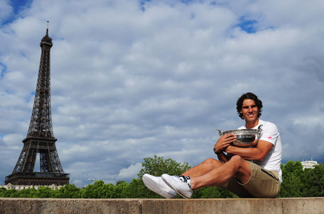 Rafael Nadal of Spain poses with the Coupe des Mousquetaires trophy in front of the Eiffel Tower after his victory against Novak Djokovic of Serbia in the French Open at Roland Garros on Monday in Paris. (GETTY)