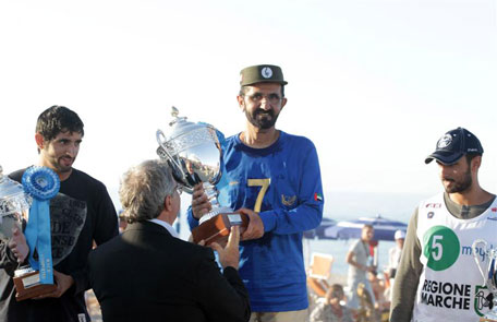 Sheikh Mohammed receives the winner's cup with Sheikh Hamdan and Sheikh Majed.