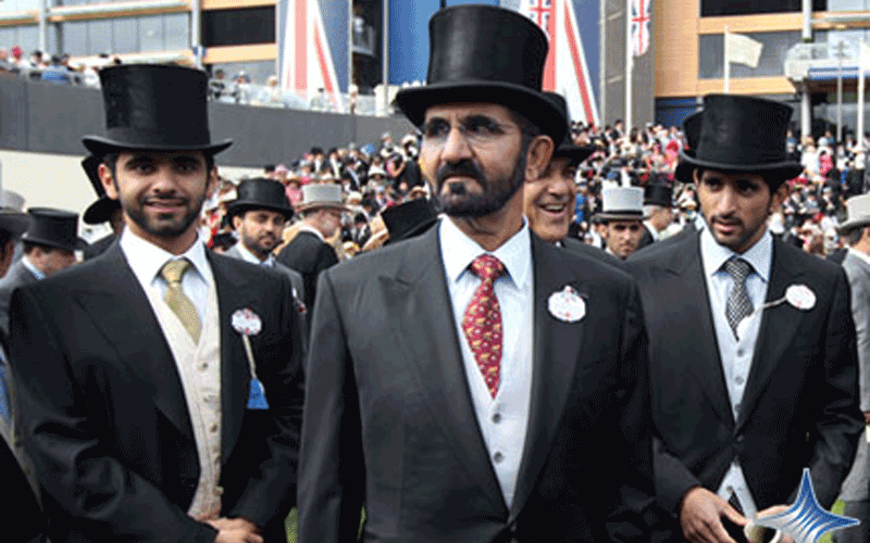 Mohammed bin Rashid and his two sons Hamdan and Mansour watch the race