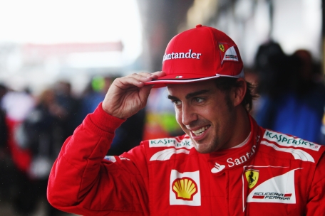 Fernando Alonso of Spain and Ferrari celebrates in parc ferme after finishing first during qualifying for the British Grand Prix at Silverstone Circuit on Saturday in Northampton, England. (GETTY)