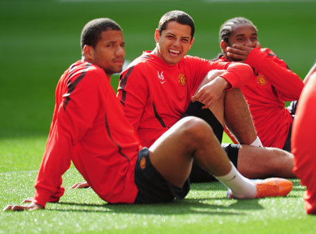 Bebe (left) with Javier Hernandez and Anderson of Manchester United during a Manchester United training session in this May 27, 2011 file photo. (GETTY)