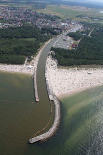 Leba is giving the beach sand away for free to everyone from toddlers to construction companies because it is being blown by wind from nearby moving dunes and into the canal, incurring great costs of dredging. (AP)