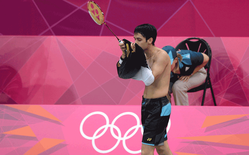 Kashyap Parupalli of India kisses his jersey after victory in his men's singles badminton match against Niluka Karunaratne of Sri Lanka at the London 2012 Olympic Games in London. Parupalli won the match 21-14, 15-21, 21-9. (AFP)