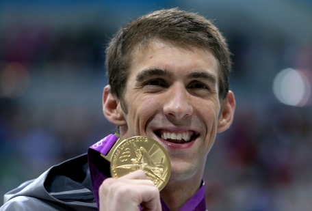 Gold medallist Michael Phelps of the United States poses with the medal won in the Men's 200m Individual Medley final on Day 6 of the London 2012 Olympic Games at the Aquatics Centre on Thursday in London, England. (GETTY)