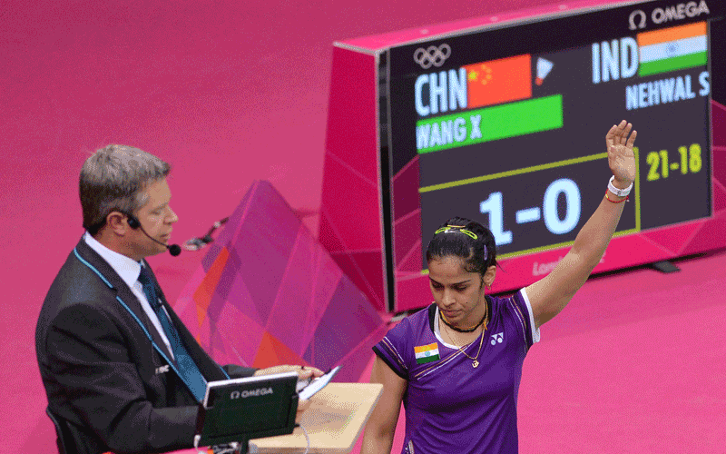 India's Saina Nehwal acknowledges the crowds applause after winning the bronze medal against China's Wang Xin in their bronze medal women's singles badminton match at the London 2012 Olympic Games in London. (AFP)