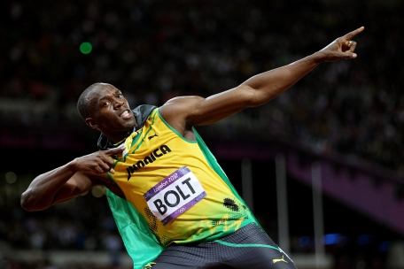Usain Bolt of Jamaica celebrates winning gold in the Men'’s 100m Final on Day 9 of the London 2012 Olympic Games at the Olympic Stadium on Sunday in London, England. (GETTY)