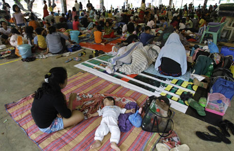 A Filipino baby sleeps at an evacuation center at Marikina, east of Manila, Philippines. Heavy rains forced some classes to be suspended as hundreds of residents living in low-lying areas evacuated their homes due to high floods and rising of dam levels. (AP)