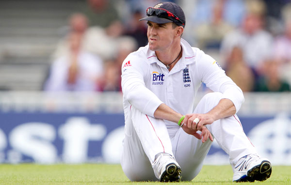 England's Kevin Pietersen sits on the pitch during the third day of the first Test against South Africa at the Oval cricket ground, London.  (AP)