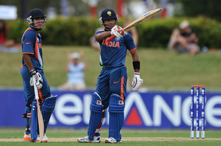 Unmukt Chand (right) of India celebrates reaching his century during the 2012 ICC U19 Cricket World Cup final against Australia at Tony Ireland Stadium on Sunday in Townsville, Australia. (GETTY)
