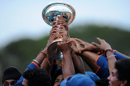 Indian players hold the trophy aloft after the 2012 ICC U19 Cricket World Cup final against Australia at Tony Ireland Stadium on Sunday in Townsville, Australia. (GETTY)