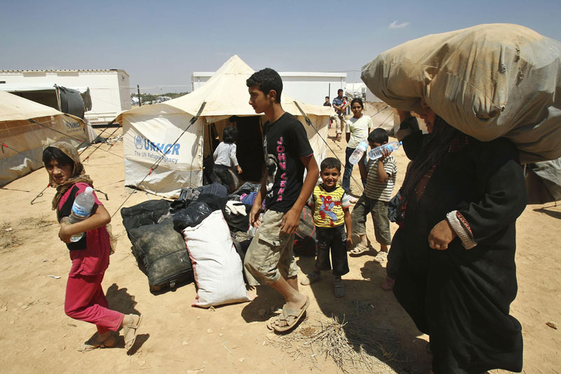 Syrian refugees arrive at the Al Za'atri refugee camp in the Jordanian city of Mafraq, near the border with Syria on August 29. (Reuters)