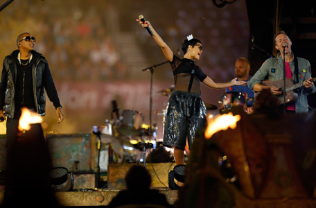 US rapper Jay-Z, left, singer Rihanna, center, from Barbados and British musician Chris Martin, right, the frontman of the band Coldplay perform during the closing ceremony for the 2012 Paralympics, Sunday, Sept. 9, 2012, in London.  (AP)