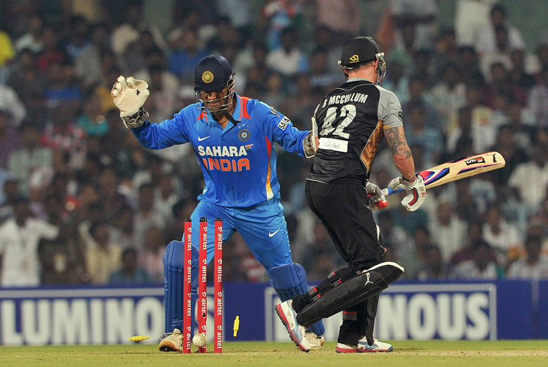 New Zealand batsman Brendon McCullum (right) looks back while Indian captain and wicket keeper Mahendra Singh Dhoni stumps him out during the second T20 match between India and New Zealand at the M.A. Chidambaram Stadium in Chennai on Tuesday September 1. (AFP)