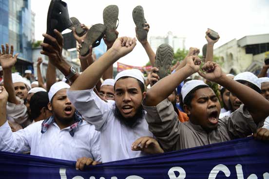 Islamic party activists protest against an internet film mocking Islam in Dhaka on September 14, 2012. About 10,000 protesters in Bangladesh burnt American and Israeli flags and tried to march to the US embassy on September 14 to demonstrate against an anti-Islam film that has infuriated the Muslim world (AFP)