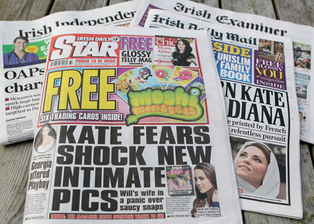 A picture taken on September 15, 2012 in Dundalk, Ireland shows an arrangement of Irish newspapers with the front page of the Irish Daily Star and its headline regarding intimate and topless pictures of Britain's Catherine, Duchess of Cambridge, reprinted inside the newspaper. (AFP)