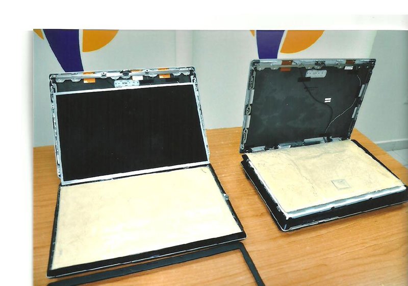 The two laptop computers in which heroin was concealed.