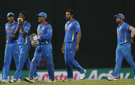 India's cricketers from left Ravichandran Ashwin, Lakshmipathi Balaji, captain Mahendra Singh Dhoni, Zaheer Khan and Suresh Raina walk back to the pavilion after the ICC Twenty20 Cricket World Cup Super Eight match between India and South Africa in Colombo, Sri Lanka, Tuesday, Oct. 2, 2012. (AP)