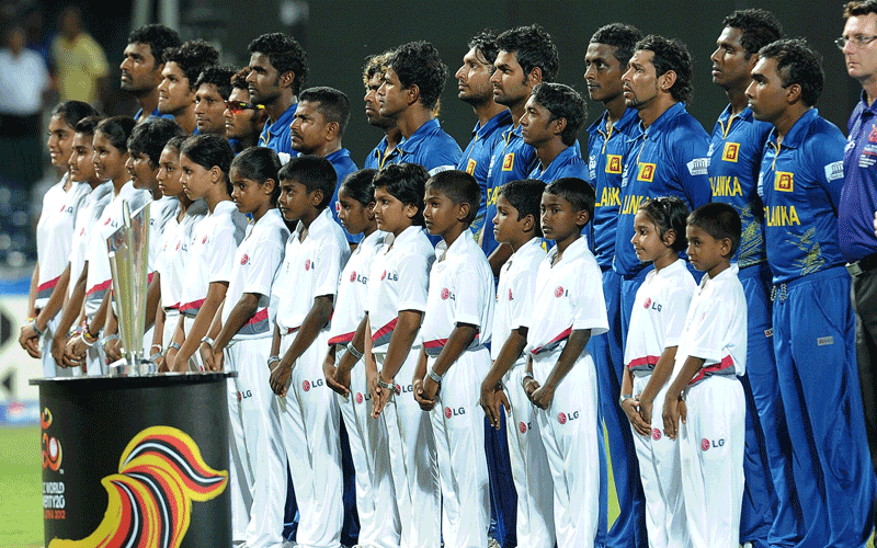 Sri Lankan cricketers observe their national anthem before the start of the ICC Twenty20 Cricket World Cup's final match between Sri Lanka and West Indies at the R. Premadasa International Cricket Stadium in Colombo.(AFP)