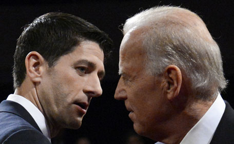 US Vice President Joe Biden (R) and Republican vice presidential candidate Paul Ryan depart the stage following their vice presidential debate at Centre College in Danville, Kentucky, on October 11, 2012.  (AFP)