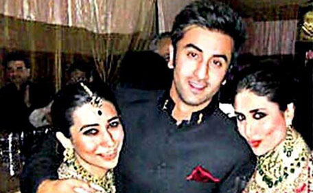 One for the family album: Bollywood actor Ranbir Kapoor hugs actress cousins Karisma and Kareena. (IMAGE POSTED ON FACEBOOK by Worldwide Boxoffice)