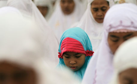 Muslims pray marking the sacrifice day of Eid al-Adha at Sunda Kelapa port in Jakarta October 26, 2012. Indonesia, the world's most populous Muslim nation, celebrates Eid al-Adha by slaughtering goats and cows and distributing the meat to the poor. (REUTERS)